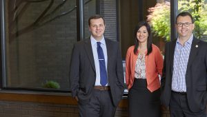 The Wabash Valley Power Economic Development team standing together in front of a window