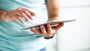 Person browsing the internet on a tablet