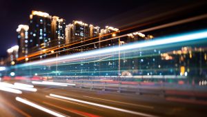 Lights streaking through a cityscape at night