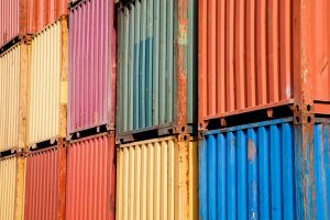 Stacked shipping containers of different colors