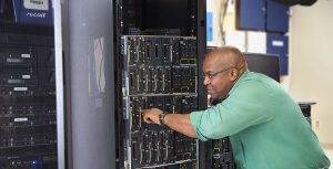 Curtis Taylor of Wabash Valley Power inspects computer servers