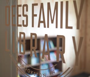 Bookcase through library window.